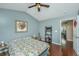 Bright bedroom featuring wood floors, vaulted ceilings, and ceiling fan at 7977 Shadow Oak Dr, North Charleston, SC 29406