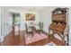 Inviting dining room with hardwood floors, a glass table, and a cozy atmosphere at 7977 Shadow Oak Dr, North Charleston, SC 29406