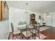 Elegant dining room featuring a glass table, chandelier, and stylish decor for entertaining at 7977 Shadow Oak Dr, North Charleston, SC 29406