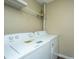 Bright laundry area with a modern Amana washer and dryer set at 7977 Shadow Oak Dr, North Charleston, SC 29406