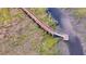 Aerial view of a dock and wooden walking bridge stretching across the marshland at 8585 Refuge Pointe Cir, North Charleston, SC 29420