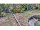 An aerial view of a wooden walking bridge stretches across the marshland at 8585 Refuge Pointe Cir, North Charleston, SC 29420