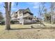 Expansive yard with outdoor firepit and multiple decks offers ample space for enjoyment and entertaining at 8585 Refuge Pointe Cir, North Charleston, SC 29420