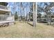 Spacious backyard with a hammock, trampoline, and fire pit; perfect for outdoor fun and relaxation at 8585 Refuge Pointe Cir, North Charleston, SC 29420