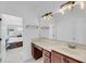 Bathroom featuring a vanity and mirrors, offering a glimpse into the adjacent space at 8585 Refuge Pointe Cir, North Charleston, SC 29420