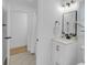 Bright and clean bathroom features a modern vanity, great lighting, and shower at 8585 Refuge Pointe Cir, North Charleston, SC 29420