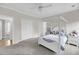 Cozy bedroom featuring a four-poster bed, soft carpet, and a ceiling fan for added comfort at 8585 Refuge Pointe Cir, North Charleston, SC 29420
