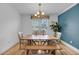 Cozy dining room with wooden table, bench seating, and natural lighting at 8585 Refuge Pointe Cir, North Charleston, SC 29420