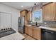 Modern kitchen with stainless steel appliances and light wood cabinets at 8585 Refuge Pointe Cir, North Charleston, SC 29420