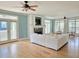 Bright, open living room featuring hardwood floors, fireplace, and access to outdoor balcony at 8585 Refuge Pointe Cir, North Charleston, SC 29420