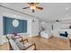 Open concept living area with hardwood floors, comfortable seating, and bright natural light at 8585 Refuge Pointe Cir, North Charleston, SC 29420