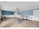 Bright living room boasts hardwood floors, neutral tones, and comfortable furniture at 8585 Refuge Pointe Cir, North Charleston, SC 29420