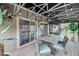 Relaxing screened patio with a dining area, overhead lights, and access to the home through sliding glass doors at 8585 Refuge Pointe Cir, North Charleston, SC 29420