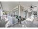 Inviting covered porch with stylish decor and stairway access on this beautiful home at 8585 Refuge Pointe Cir, North Charleston, SC 29420