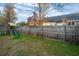 A spacious backyard featuring a wooden playset and string lights along the fence at 8849 Kellum Dr, North Charleston, SC 29420
