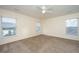 Bright and airy bedroom with a ceiling fan and large windows at 8849 Kellum Dr, North Charleston, SC 29420