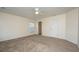 Spacious bedroom with a ceiling fan and a walk-in closet for ample storage at 8849 Kellum Dr, North Charleston, SC 29420