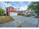 Charming two-story home with a well-manicured lawn, large driveway, and attached two car garage at 8849 Kellum Dr, North Charleston, SC 29420
