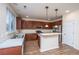 Well-lit kitchen with stainless steel appliances, granite countertops, and a kitchen island at 8849 Kellum Dr, North Charleston, SC 29420