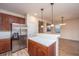 Open-concept kitchen with stainless steel appliances and granite countertops at 8849 Kellum Dr, North Charleston, SC 29420