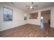 Bright living room featuring wood floors, modern ceiling fan and large windows at 8849 Kellum Dr, North Charleston, SC 29420