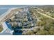 Expansive aerial view of beachside condos near a golf course with ample parking and beautiful landscaping at 9000 Palmetto Dr # G-302, Isle of Palms, SC 29451