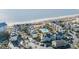 Stunning aerial view of condo community by the beach, featuring a sparkling blue pool and convenient parking at 9000 Palmetto Dr # G-302, Isle of Palms, SC 29451