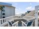 Balcony with seating area and ocean views at 9000 Palmetto Dr # G-302, Isle of Palms, SC 29451