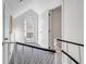 Hallway with neutral carpet and white walls with exterior door at 9000 Palmetto Dr # G-302, Isle of Palms, SC 29451