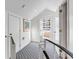 Hallway with neutral carpet and white walls with exterior door at 9000 Palmetto Dr # G-302, Isle of Palms, SC 29451