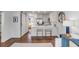 Bright open kitchen with white cabinets, stainless steel appliances, and modern breakfast bar seating at 9000 Palmetto Dr # G-302, Isle of Palms, SC 29451