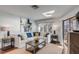 Bright living room featuring a white couch, stylish decor, and sliding glass doors to a deck at 9000 Palmetto Dr # G-302, Isle of Palms, SC 29451