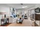 Bright living room featuring a white couch, stylish decor, and sliding glass doors to a deck at 9000 Palmetto Dr # G-302, Isle of Palms, SC 29451
