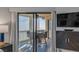 Inviting screened porch with a dining table and stunning ocean view at 9000 Palmetto Dr # G-302, Isle of Palms, SC 29451