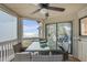 Inviting screened porch with a dining table and stunning ocean view at 9000 Palmetto Dr # G-302, Isle of Palms, SC 29451