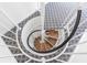 Spiral staircase featuring custom tread and patterned carpet at 9000 Palmetto Dr # G-302, Isle of Palms, SC 29451