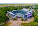 Spectacular aerial view of a lush community tennis stadium with spectator seating at 925 Fish Camp Rd, Charleston, SC 29492