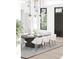 Elegant dining room with modern light fixtures and a sleek, dark-wood table at 925 Fish Camp Rd, Charleston, SC 29492