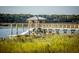 Scenic dock and gazebo overlooking calm waters with natural greenery at 925 Fish Camp Rd, Charleston, SC 29492