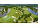 Wide aerial of the golf course with winding paths, water features, and mature trees at 925 Fish Camp Rd, Charleston, SC 29492