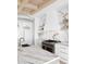 Bright, modern kitchen features marble countertops, sleek white cabinets, and stainless steel appliances at 925 Fish Camp Rd, Charleston, SC 29492
