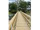 Scenic wooden bridge overlooking the water, providing a charming pathway at 925 Fish Camp Rd, Charleston, SC 29492