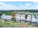 A neighborhood of two story homes with trees, marsh views, and blue skies at 94 W 2Nd St, Folly Beach, SC 29439