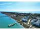 Scenic aerial view of charming waterfront community with private docks and marshland at 94 W 2Nd St, Folly Beach, SC 29439