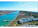 Stunning aerial view of waterfront community with private docks, blue water, and marshland at 94 W 2Nd St, Folly Beach, SC 29439