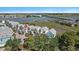 Coastal home with a gray roof near marshland and a bridge with water views at 94 W 2Nd St, Folly Beach, SC 29439