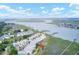Expansive aerial view showcasing waterfront townhomes nestled along the coast with picturesque river and marsh views at 94 W 2Nd St, Folly Beach, SC 29439