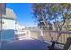 Balcony with water views and a black Adirondack chair at 94 W 2Nd St, Folly Beach, SC 29439