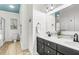 Bright bathroom with a dual sink vanity, large mirror and nautical decor at 94 W 2Nd St, Folly Beach, SC 29439