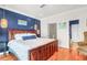 Bright bedroom with hardwood floors and coastal-themed decorations at 94 W 2Nd St, Folly Beach, SC 29439